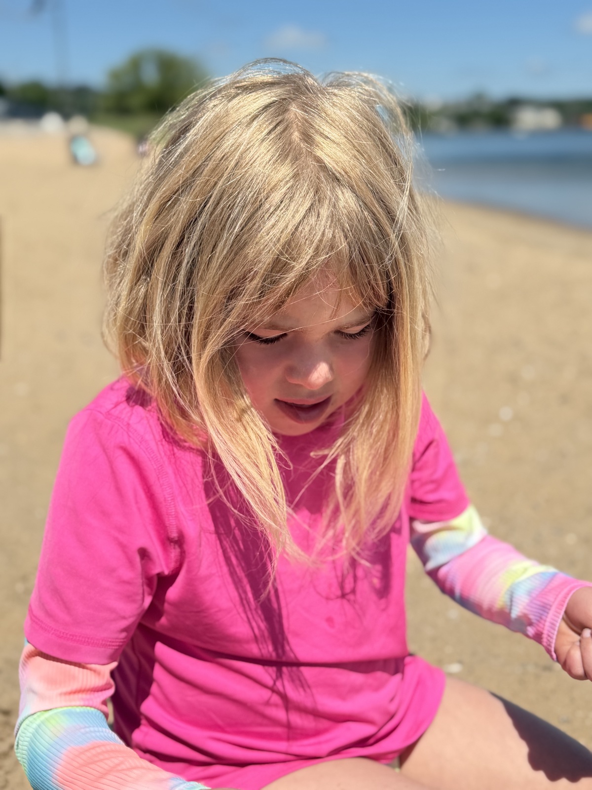 Elle playing on the beach by the water