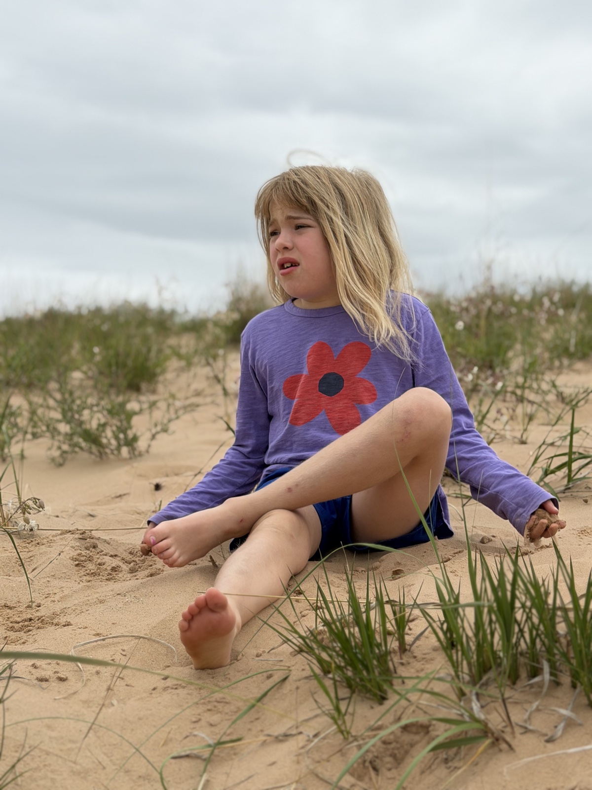 Elle sitting in the sand dunes